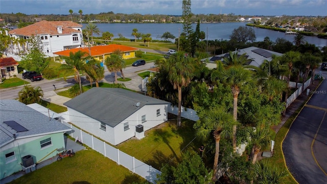 birds eye view of property with a water view and a residential view