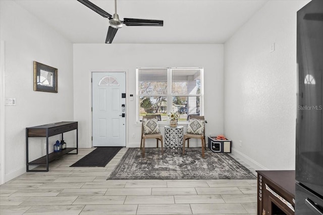 4440 58th Ave N, Saint Petersburg, FL 33714 - entrance foyer with wood tiled floor, baseboards, and a ceiling fan