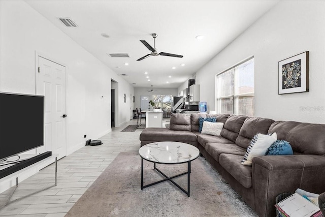 4440 58th Ave N, Saint Petersburg, FL 33714 - living area featuring wood tiled floor, visible vents, ceiling fan, and recessed lighting