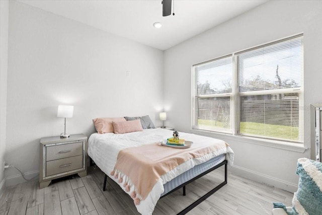 4440 58th Ave N, Saint Petersburg, FL 33714 - bedroom featuring light wood-type flooring, baseboards, and a ceiling fan