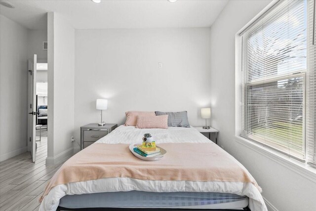4440 58th Ave N, Saint Petersburg, FL 33714 - bedroom featuring baseboards, visible vents, and light wood-style floors