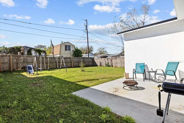 4440 58th Ave N, Saint Petersburg, FL 33714 - view of yard featuring an outdoor fire pit, a fenced backyard, and a patio