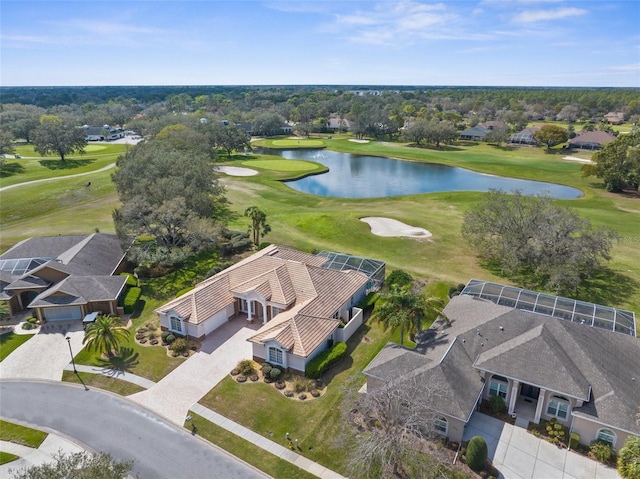 aerial view featuring golf course view, a water view, and a residential view