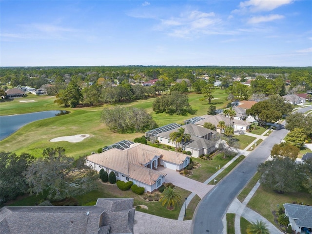 drone / aerial view featuring a water view, a residential view, and golf course view