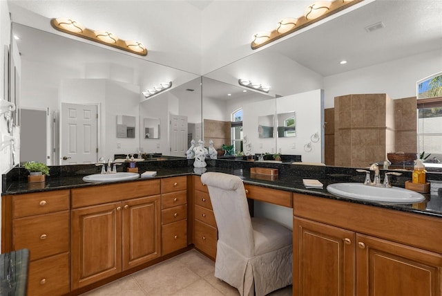 bathroom featuring visible vents, vanity, and tile patterned floors