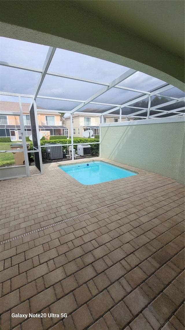 pool featuring a patio area and a lanai