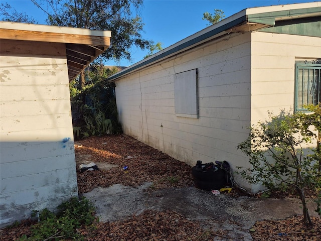 view of home's exterior with concrete block siding