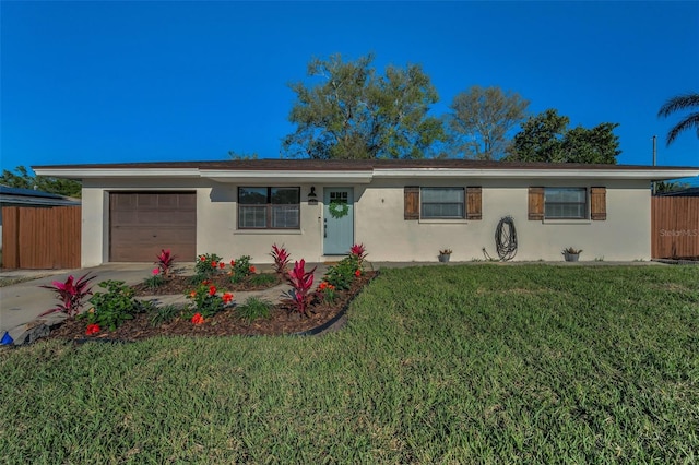 single story home with stucco siding, a garage, concrete driveway, and a front lawn