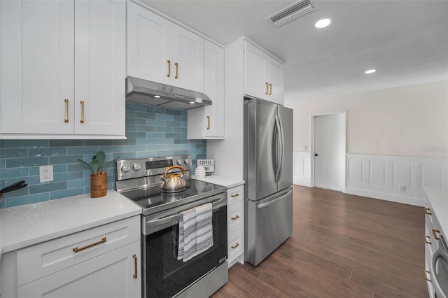 kitchen with visible vents, dark wood-type flooring, under cabinet range hood, stainless steel appliances, and white cabinetry