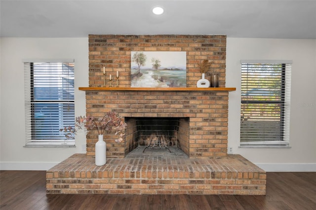 room details with recessed lighting, baseboards, wood finished floors, and a fireplace