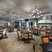 dining area featuring beam ceiling, a notable chandelier, and coffered ceiling