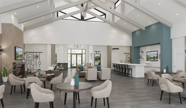 interior space with beam ceiling, high vaulted ceiling, a warm lit fireplace, and wood finished floors