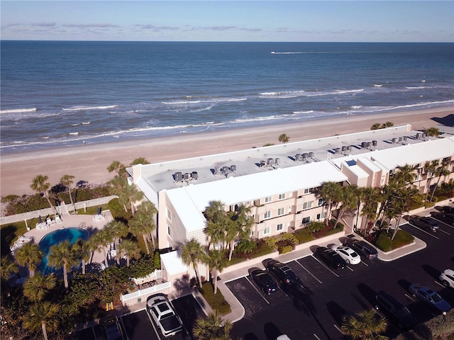 bird's eye view featuring a water view and a view of the beach