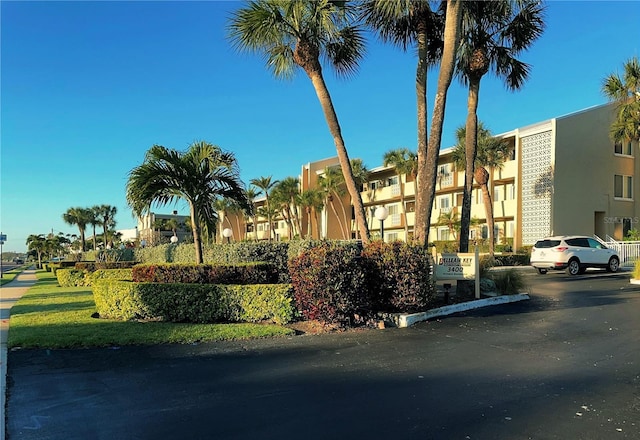 view of property featuring uncovered parking