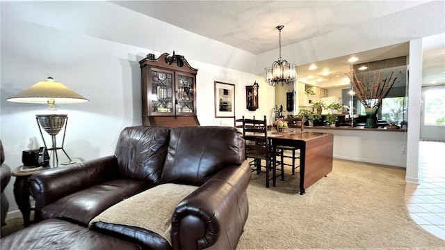 living area with light tile patterned floors, baseboards, light colored carpet, a textured ceiling, and a notable chandelier