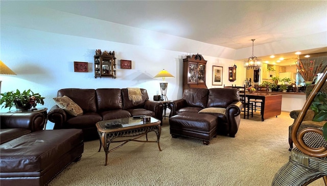 carpeted living area with an inviting chandelier