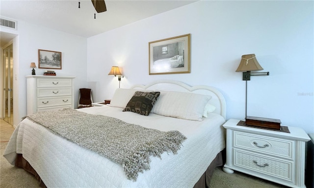 bedroom featuring carpet floors, ceiling fan, and visible vents