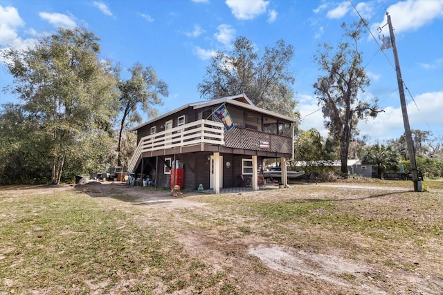 exterior space featuring driveway and a deck