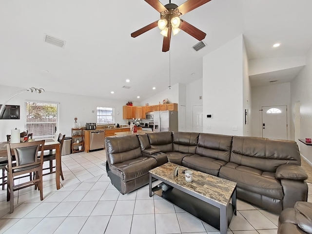 living room with recessed lighting, visible vents, vaulted ceiling, and light tile patterned flooring