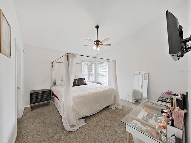 bedroom featuring lofted ceiling, light carpet, a ceiling fan, and baseboards