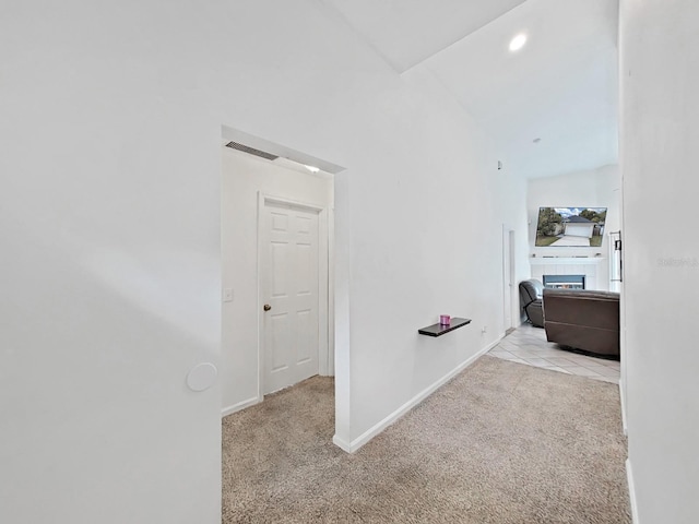 hall featuring recessed lighting, light carpet, visible vents, and baseboards