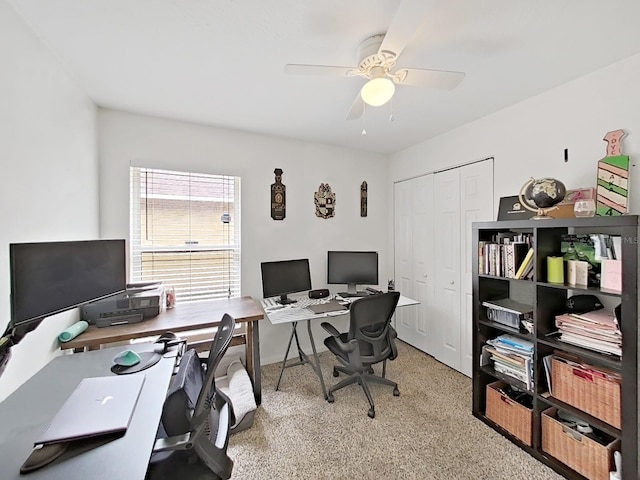 office space featuring a ceiling fan