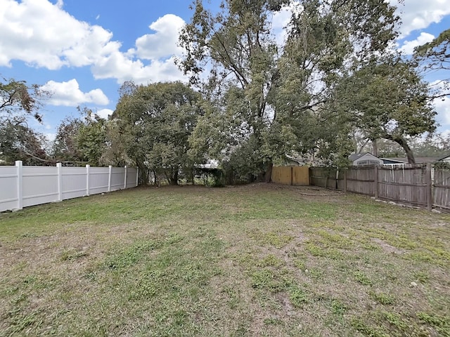 view of yard with fence