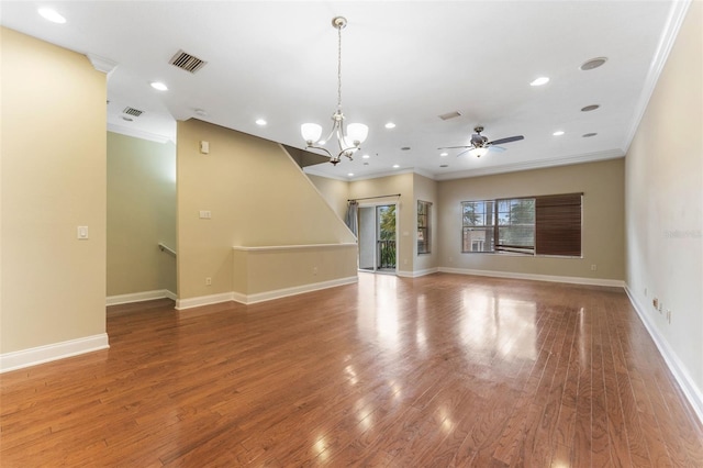 unfurnished living room featuring ornamental molding, recessed lighting, wood finished floors, and baseboards