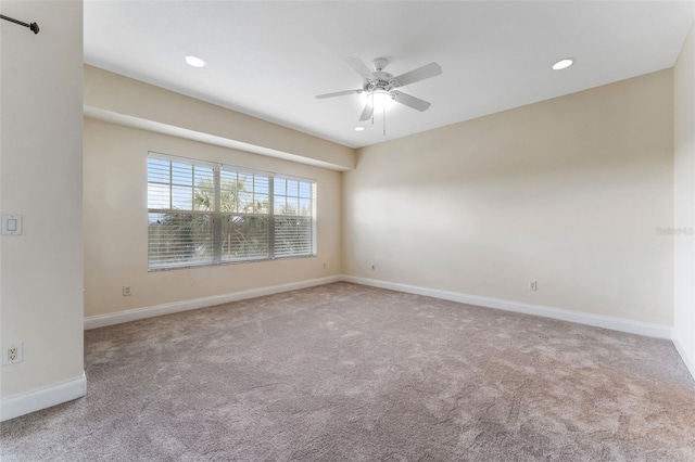 unfurnished room with light carpet, ceiling fan, recessed lighting, and baseboards