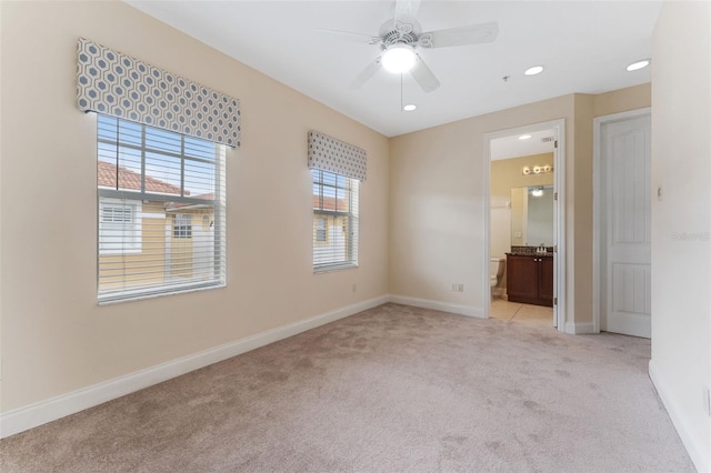 spare room featuring recessed lighting, ceiling fan, baseboards, and light colored carpet