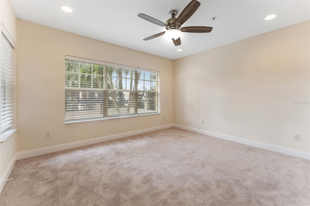 spare room with light carpet, baseboards, a ceiling fan, and recessed lighting