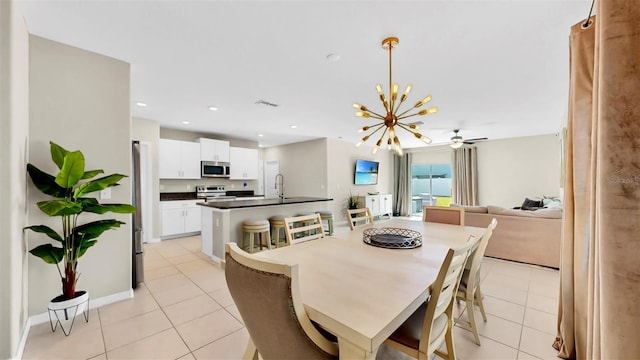 dining space featuring light tile patterned floors, recessed lighting, visible vents, baseboards, and ceiling fan with notable chandelier