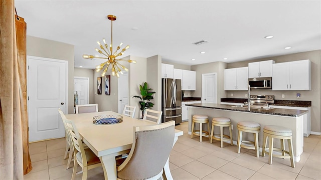 dining room featuring a chandelier, recessed lighting, visible vents, and light tile patterned flooring