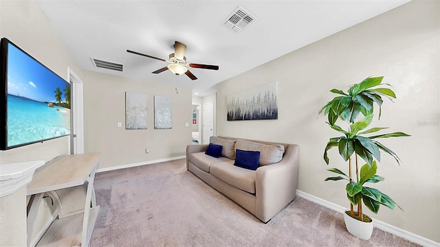 interior space featuring baseboards, visible vents, and light colored carpet