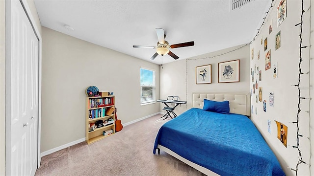 bedroom with carpet floors, a closet, visible vents, ceiling fan, and baseboards