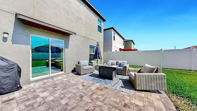 view of patio / terrace with outdoor lounge area, a fenced backyard, and a grill