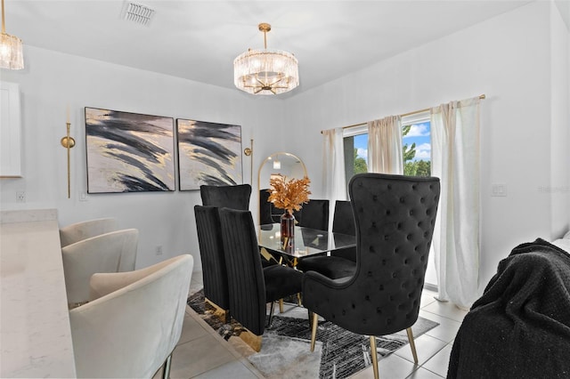 5994 Shiner St, Land O Lakes, FL 34638 - dining area with a chandelier, light tile patterned floors, and visible vents