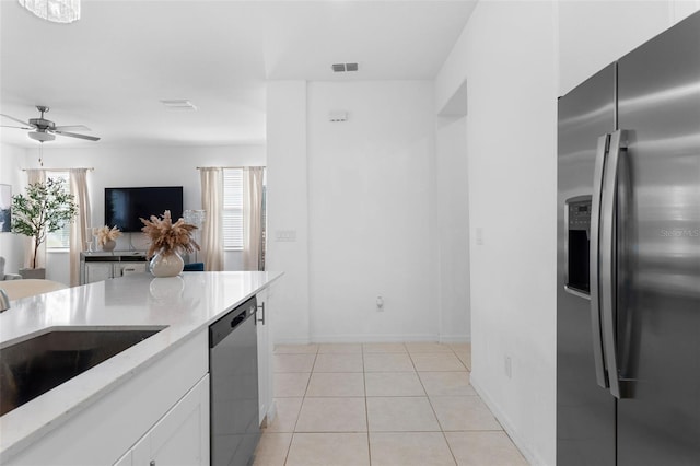 5994 Shiner St, Land O Lakes, FL 34638 - kitchen featuring a sink, visible vents, white cabinetry, light countertops, and appliances with stainless steel finishes