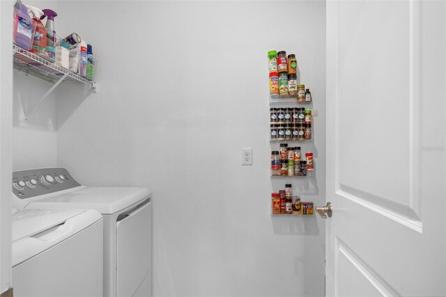 5994 Shiner St, Land O Lakes, FL 34638 - laundry room with a bar, laundry area, and washing machine and clothes dryer