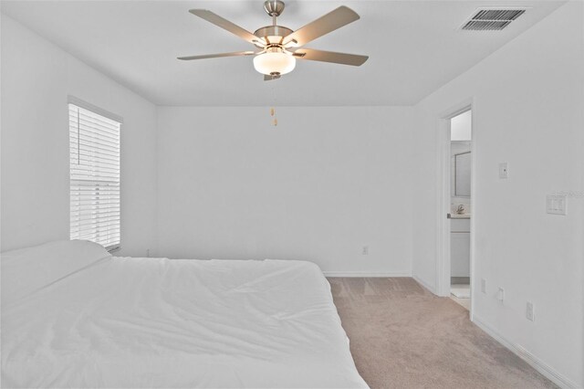 5994 Shiner St, Land O Lakes, FL 34638 - bedroom featuring light carpet, baseboards, visible vents, and ceiling fan