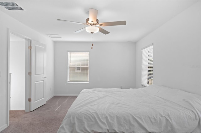5994 Shiner St, Land O Lakes, FL 34638 - bedroom with visible vents, ceiling fan, light carpet, and baseboards