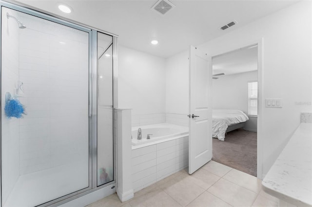 5994 Shiner St, Land O Lakes, FL 34638 - ensuite bathroom featuring a stall shower, tile patterned flooring, visible vents, and connected bathroom