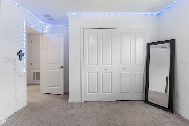 5994 Shiner St, Land O Lakes, FL 34638 - unfurnished bedroom with a closet, visible vents, and light carpet