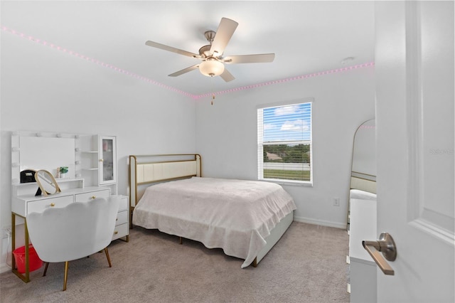5994 Shiner St, Land O Lakes, FL 34638 - bedroom featuring baseboards, a ceiling fan, and light colored carpet