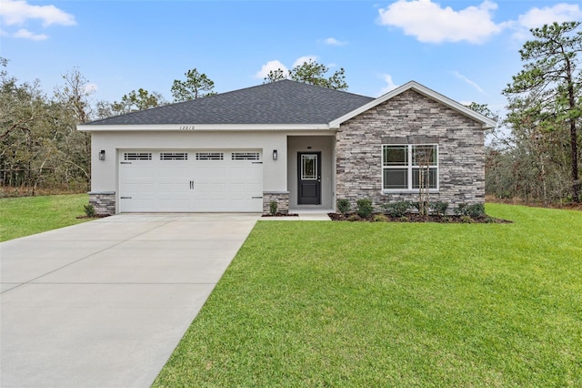 view of front of home with an attached garage, driveway, stone siding, and a front yard