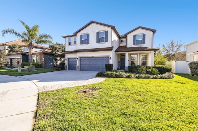 view of front of property with a garage, concrete driveway, a front lawn, and fence