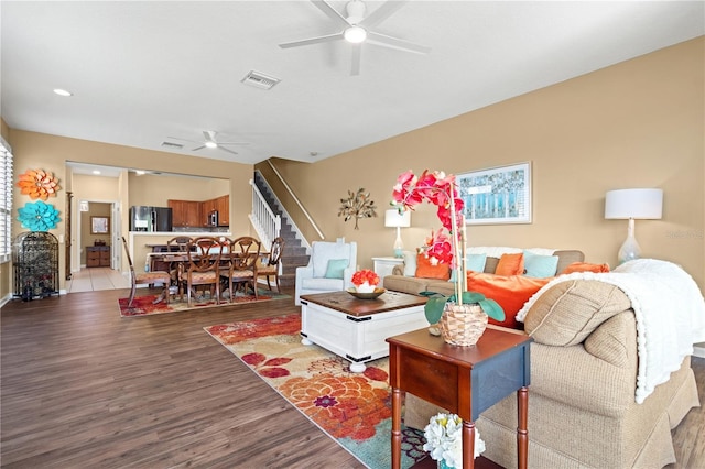 2824 Conch Hollow Dr, Brandon, FL 33511 - living area with visible vents, stairs, a ceiling fan, and wood finished floors
