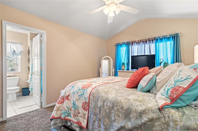 2824 Conch Hollow Dr, Brandon, FL 33511 - bedroom with arched walkways, light colored carpet, vaulted ceiling, ceiling fan, and baseboards