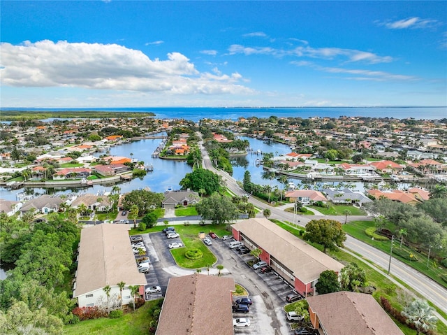 birds eye view of property featuring a water view and a residential view