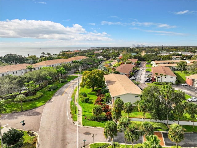 bird's eye view featuring a water view and a residential view